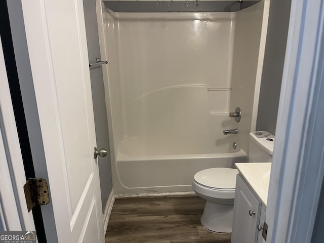 bathroom with vanity, wood-type flooring, and toilet