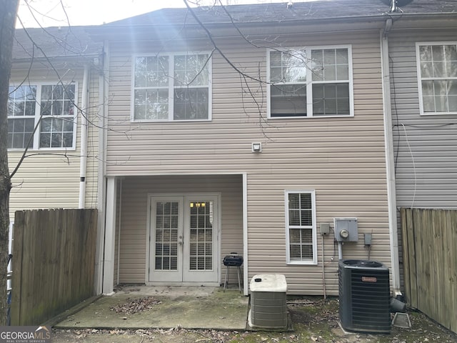 back of house featuring cooling unit, a patio area, and french doors