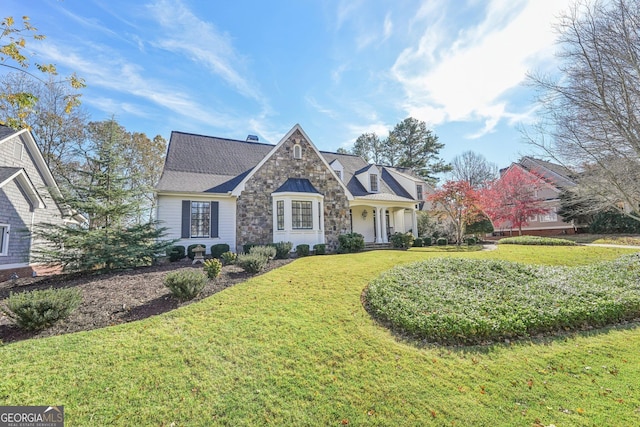 view of front of property with a front lawn