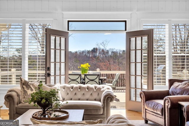 living room with plenty of natural light and wood-type flooring