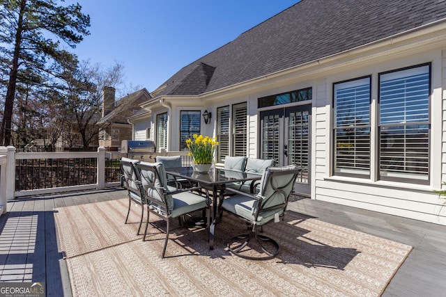 wooden terrace with area for grilling