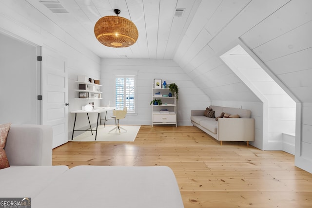 bedroom featuring vaulted ceiling, light hardwood / wood-style floors, and wooden ceiling