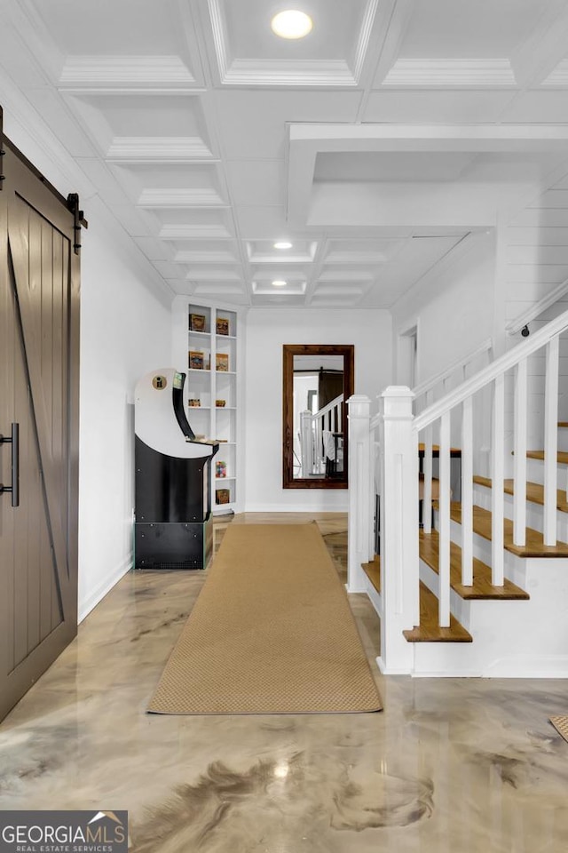 staircase with beamed ceiling, concrete floors, coffered ceiling, a barn door, and built in shelves