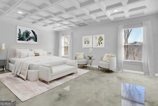 bedroom with coffered ceiling, beam ceiling, and concrete floors