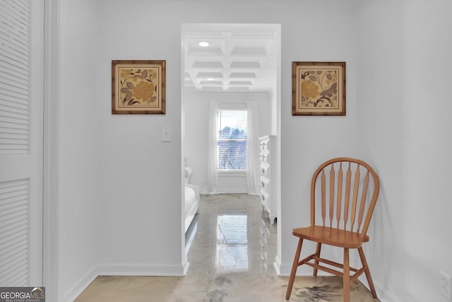 hallway with coffered ceiling and beam ceiling