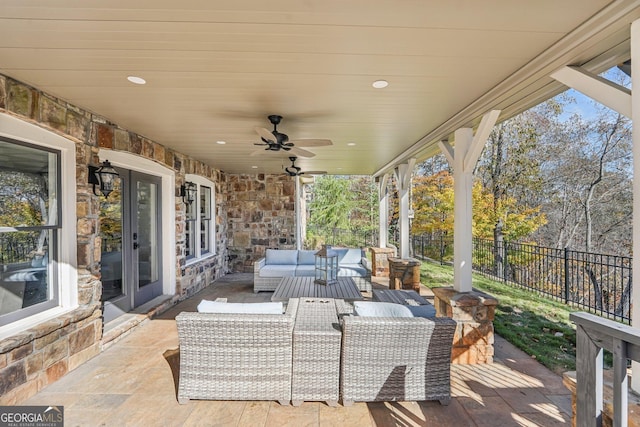 view of patio / terrace featuring an outdoor hangout area, ceiling fan, and french doors