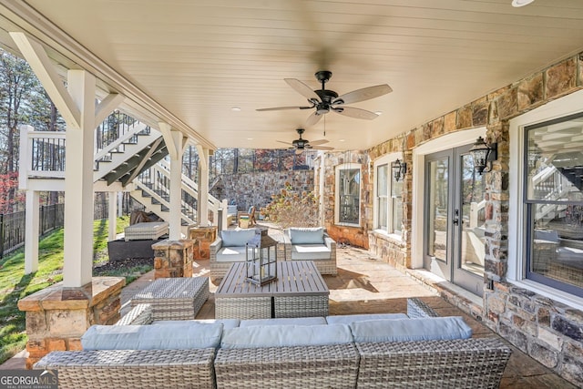 view of patio with ceiling fan and outdoor lounge area