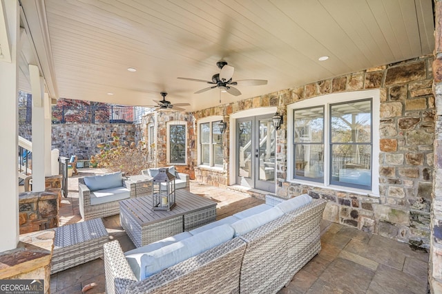 view of patio / terrace with french doors, ceiling fan, and an outdoor living space