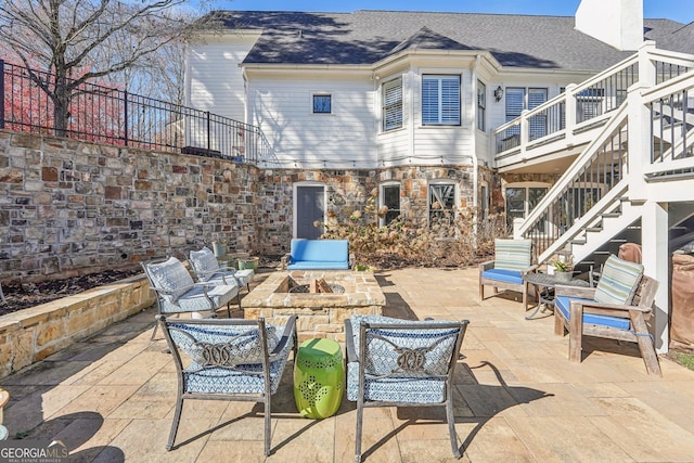 view of patio with a fire pit