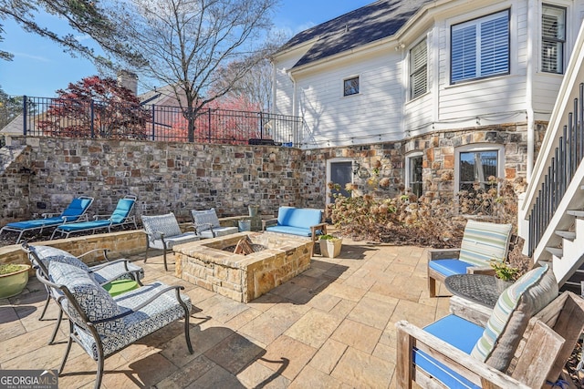 view of patio with an outdoor fire pit