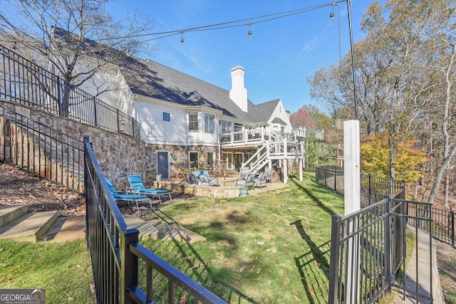 back of property featuring a yard and a patio