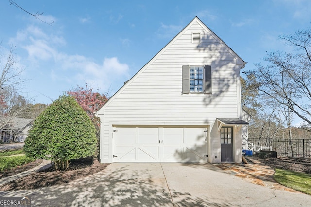 view of property exterior featuring a garage