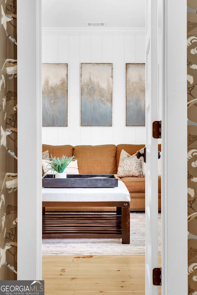 sitting room featuring light hardwood / wood-style flooring