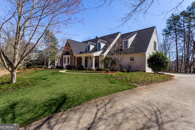 new england style home with a front yard