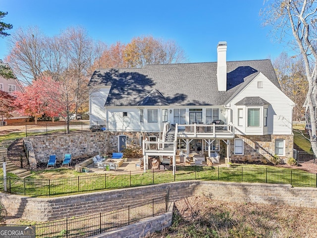 rear view of property with a yard, outdoor lounge area, and a patio