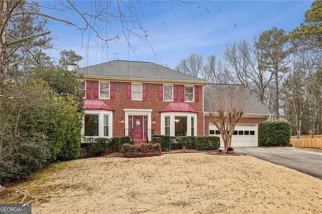 colonial home with a garage