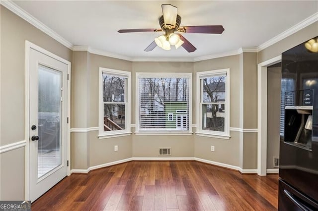 interior space featuring crown molding, ceiling fan, and dark hardwood / wood-style flooring