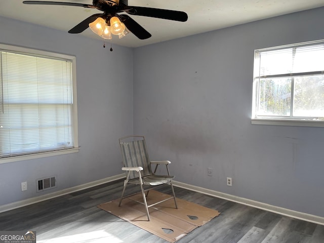 unfurnished room with dark hardwood / wood-style flooring and ceiling fan