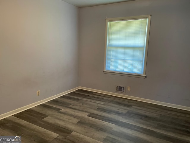 empty room featuring dark hardwood / wood-style floors