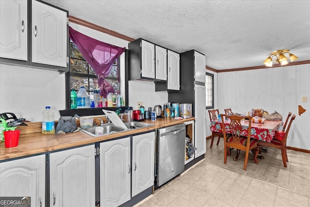 kitchen with white cabinetry, dishwasher, sink, and a wealth of natural light