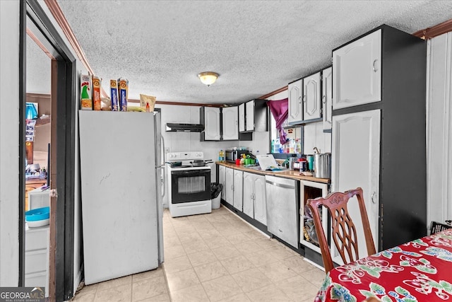 kitchen featuring white appliances, sink, a textured ceiling, and white cabinets