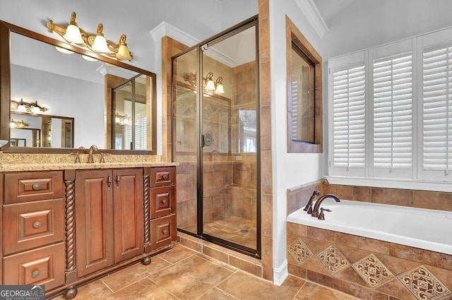 bathroom with vanity, ornamental molding, and shower with separate bathtub