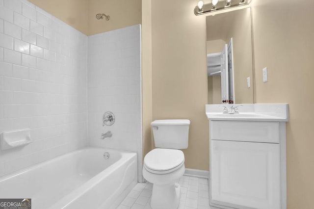 full bathroom featuring vanity, toilet, tiled shower / bath combo, and tile patterned flooring