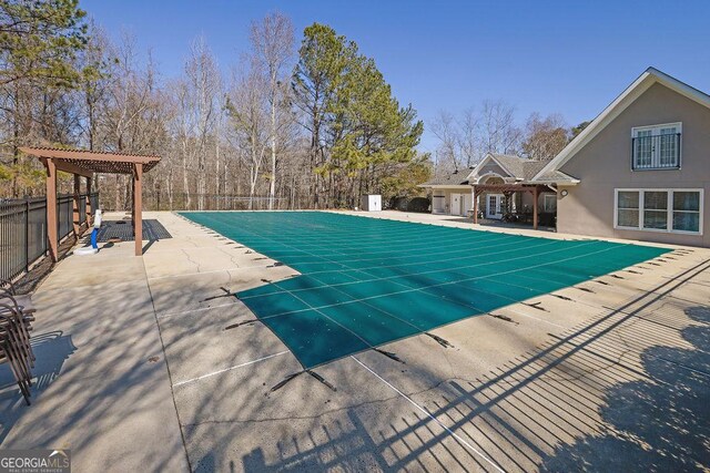 view of pool featuring a pergola and a patio