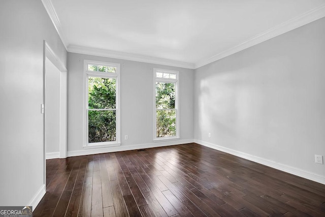 spare room with dark wood-type flooring and ornamental molding