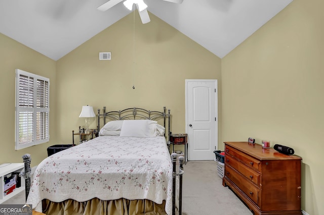 bedroom featuring a ceiling fan, light colored carpet, visible vents, and high vaulted ceiling