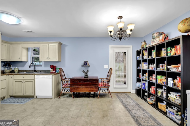 kitchen with cream cabinetry, visible vents, a sink, a chandelier, and dishwasher