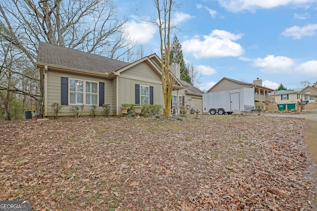 view of front of home with a shingled roof and board and batten siding