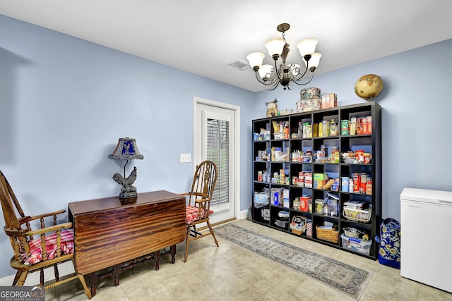 office featuring visible vents, a notable chandelier, and baseboards