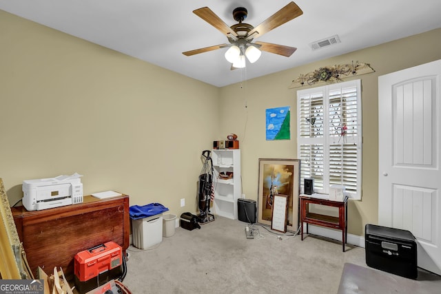 miscellaneous room featuring carpet floors, visible vents, ceiling fan, and baseboards