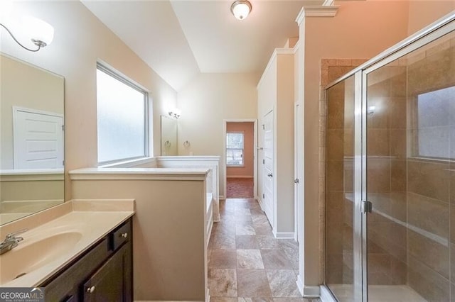 bathroom featuring vanity and a shower with door