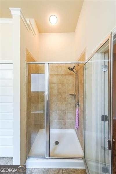 bathroom with an enclosed shower