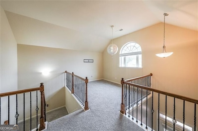 interior space with lofted ceiling and carpet floors