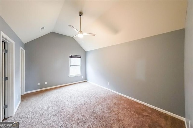 interior space with lofted ceiling, carpet floors, and ceiling fan