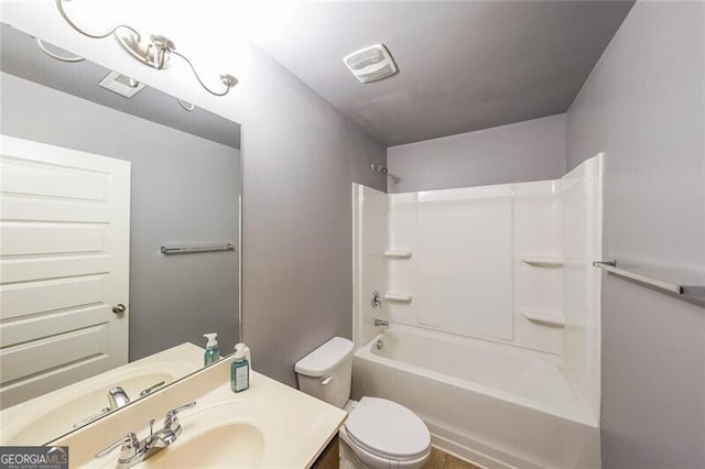 full bathroom with vanity, tub / shower combination, and toilet