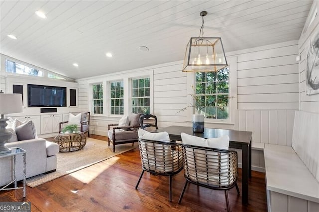 living room with wood-type flooring and lofted ceiling