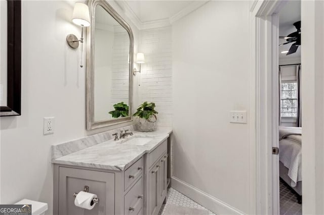 bathroom featuring vanity, ornamental molding, and ceiling fan