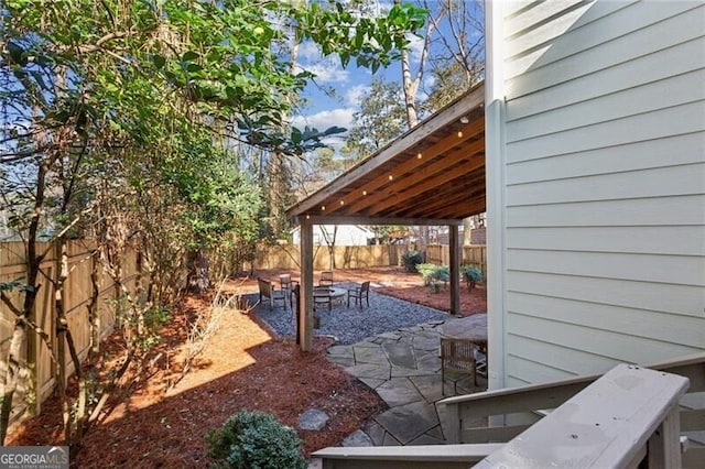 view of patio with an outdoor fire pit