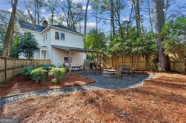 exterior space with an outdoor fire pit