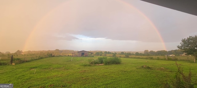 view of yard with a rural view