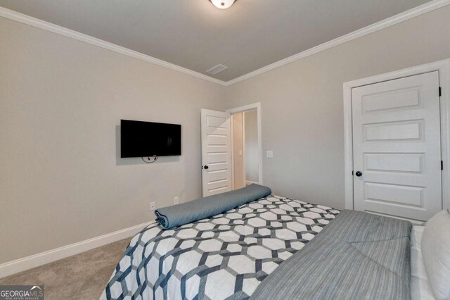 carpeted bedroom with crown molding