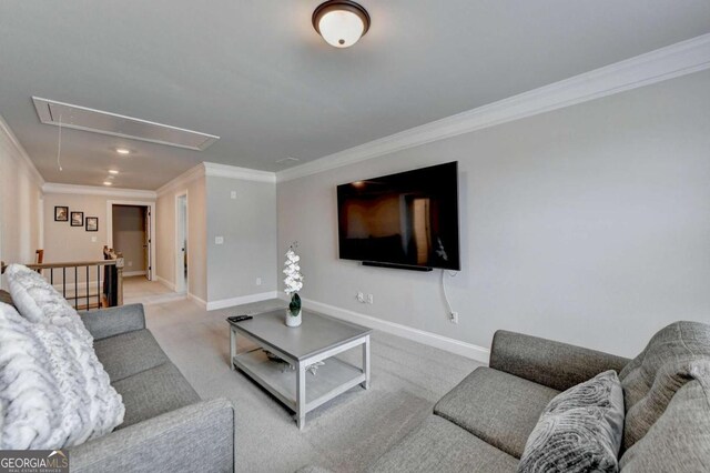 living room with ornamental molding and light colored carpet