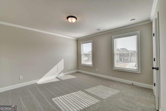 carpeted empty room with crown molding