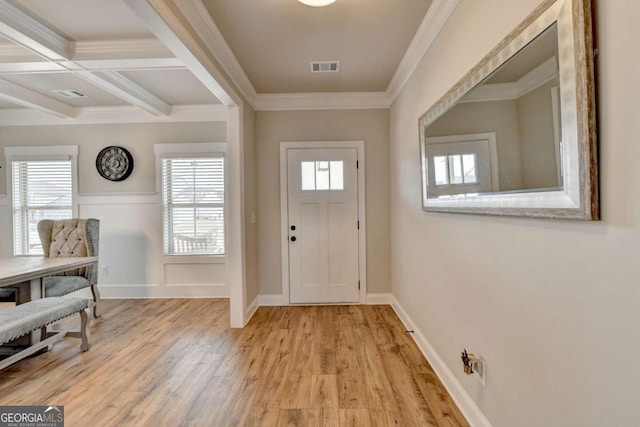 foyer entrance with crown molding, coffered ceiling, beam ceiling, and light hardwood / wood-style flooring