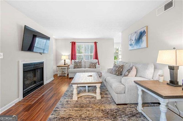 living room featuring dark wood-type flooring