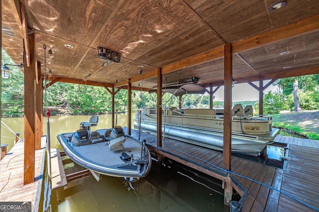 view of dock featuring a water view and boat lift